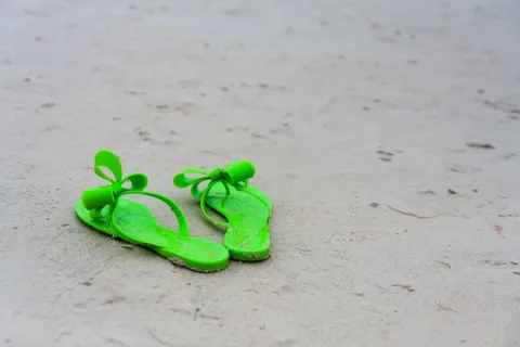  green plastic ladies slippers that are perfect for public 